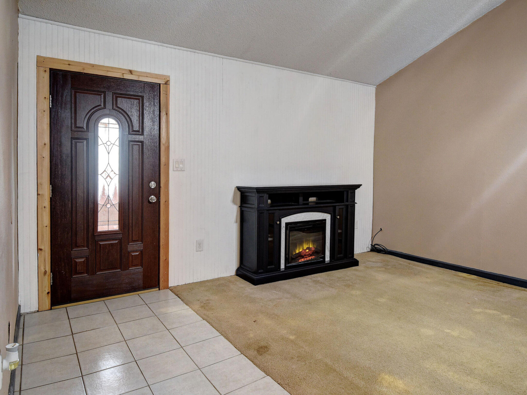176 Lacy Drive Elgin, TX 78621 - Photo 9 of 40 a view of an empty room with window and a fireplace