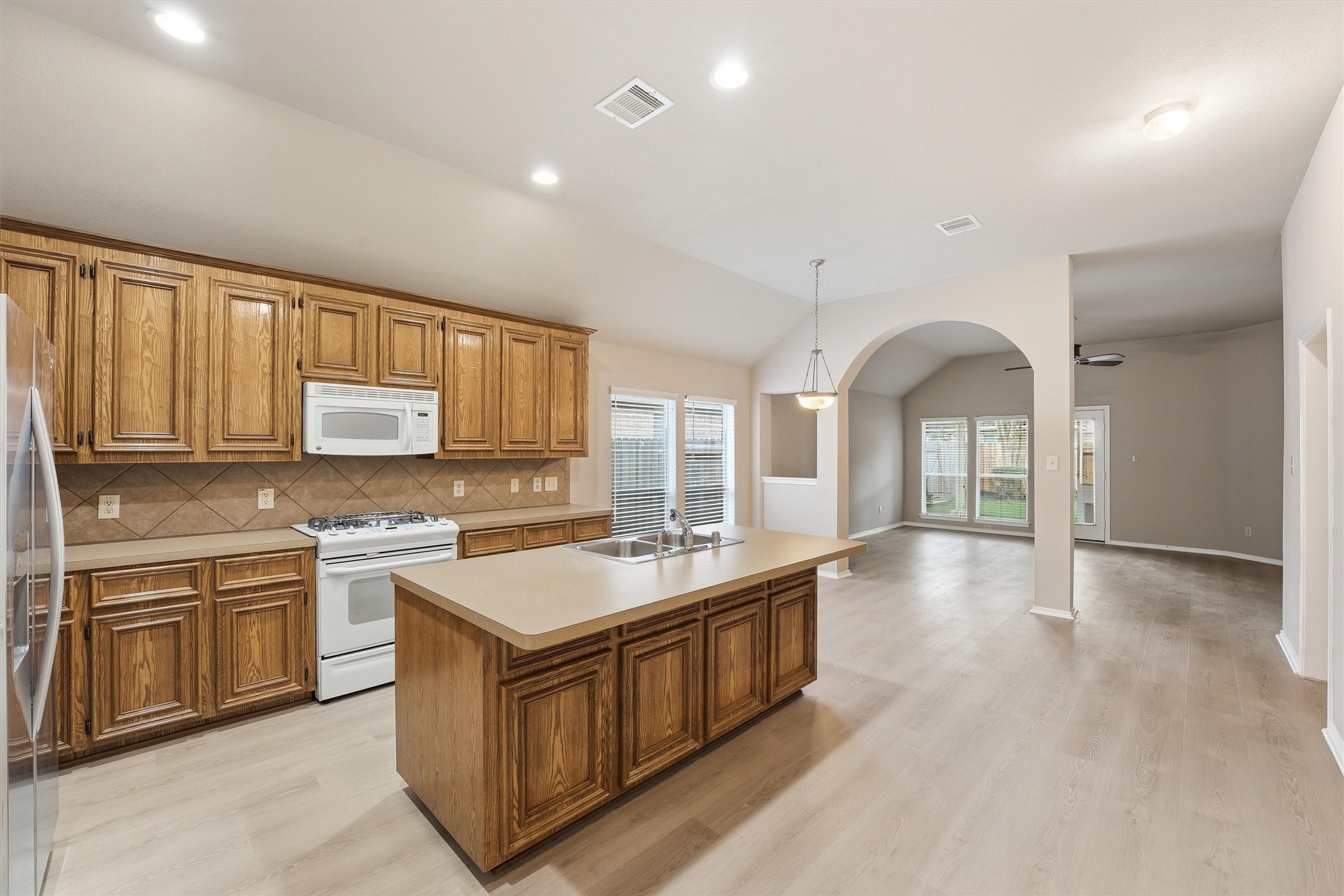 20931 Hamlet Ridge Lane Katy, TX 77449 - Photo 7 of 23 Open-concept design seamlessly connecting living, kitchen, and breakfast areas.