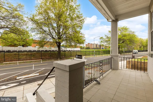 a view of a terrace with wooden floor and fence