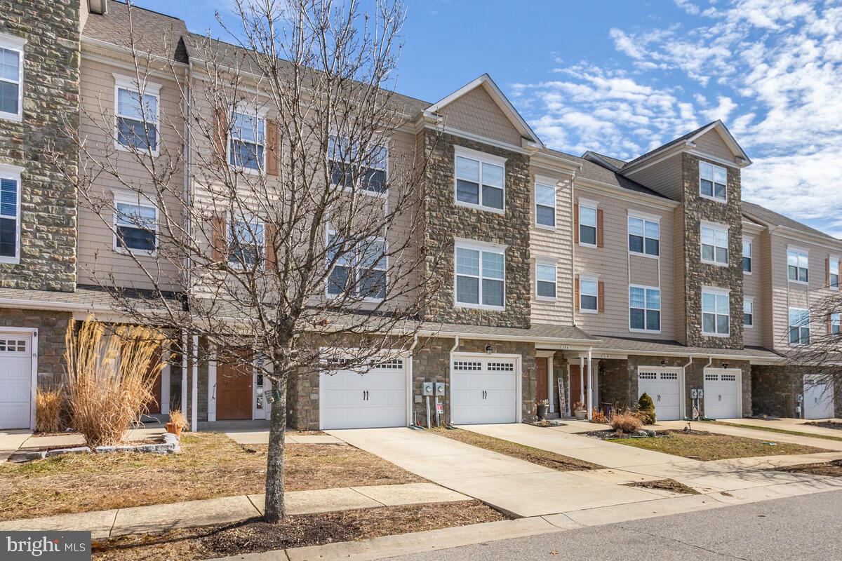 102 Backstretch Way Prince Frederick, MD 20678 - Photo 1 of 44 a street corner with a building in the background