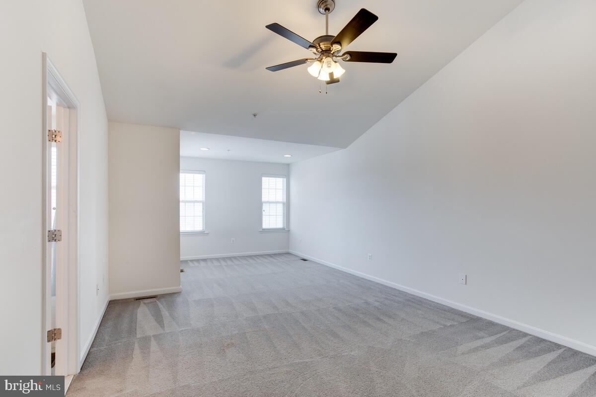 102 Backstretch Way Prince Frederick, MD 20678 - Photo 21 of 44 an empty room with windows and fan