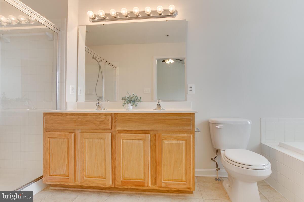 102 Backstretch Way Prince Frederick, MD 20678 - Photo 24 of 44 a bathroom with a sink a toilet and mirror
