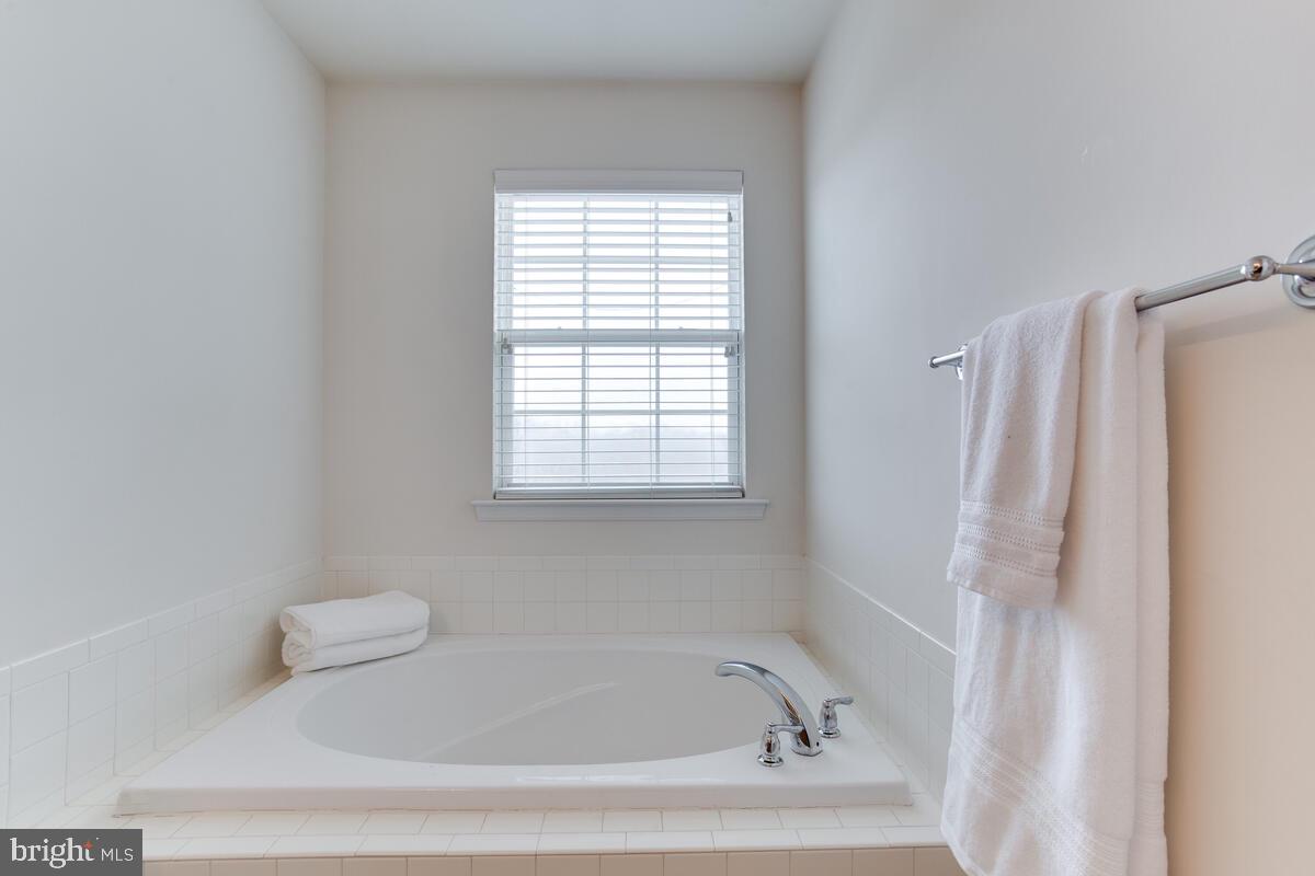 102 Backstretch Way Prince Frederick, MD 20678 - Photo 25 of 44 a white bath tub sitting next to a white sink