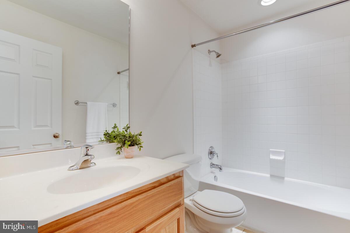 102 Backstretch Way Prince Frederick, MD 20678 - Photo 30 of 44 a bathroom with a sink a toilet and a bathtub