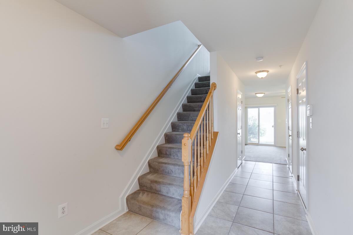 102 Backstretch Way Prince Frederick, MD 20678 - Photo 4 of 44 a view of a hallway with entryway and stairs