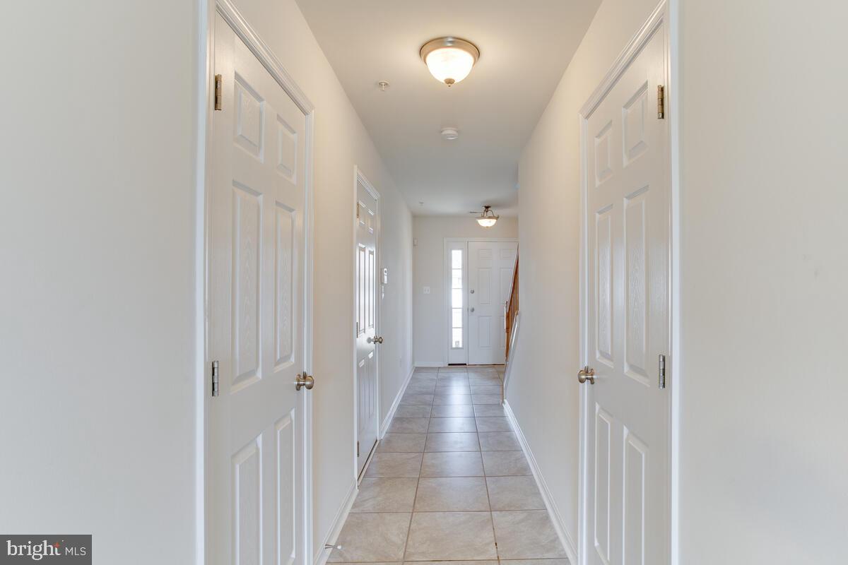 102 Backstretch Way Prince Frederick, MD 20678 - Photo 33 of 44 a view of a hallway with a window