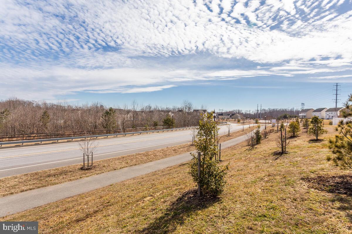 102 Backstretch Way Prince Frederick, MD 20678 - Photo 42 of 44 a view of a yard with an ocean beach
