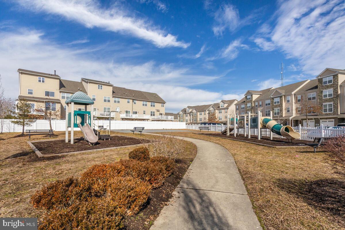 102 Backstretch Way Prince Frederick, MD 20678 - Photo 44 of 44 a view of a swimming pool with a patio