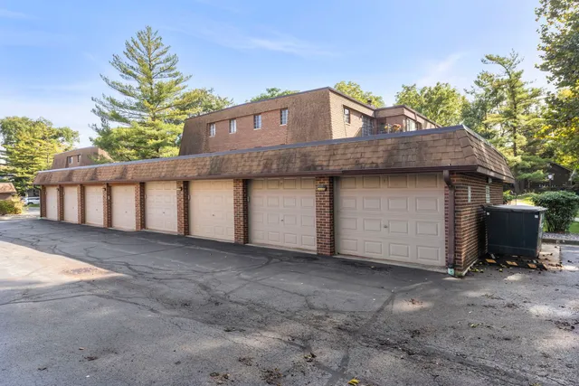 a view of a house with a yard and garage