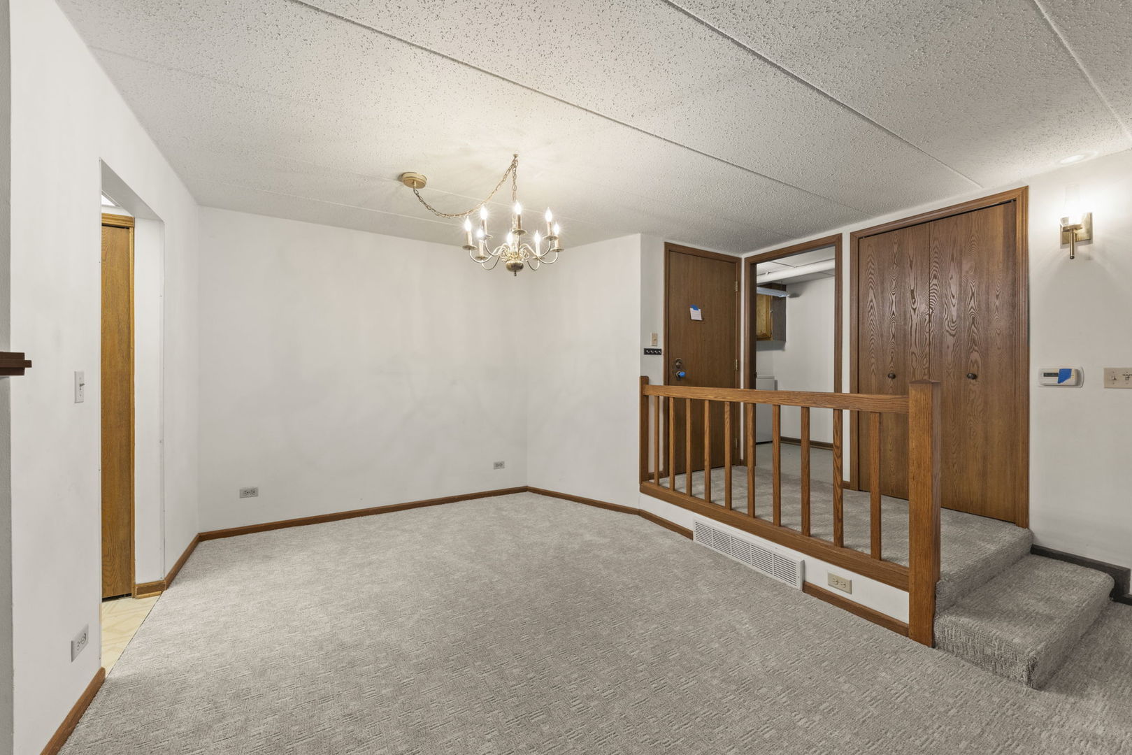 393 Duane Street, Unit 203 Glen Ellyn, IL 60137 - Photo 6 of 18 an empty room with windows and entryway