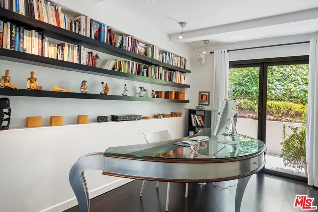 a room with furniture and a book shelf