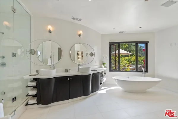 a view of bathroom with dual sinks