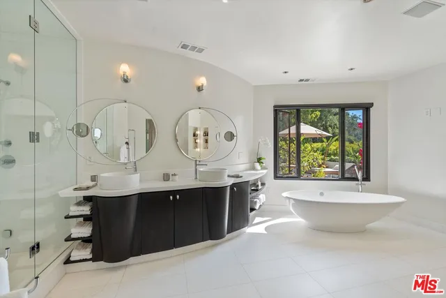 a view of bathroom with dual sinks