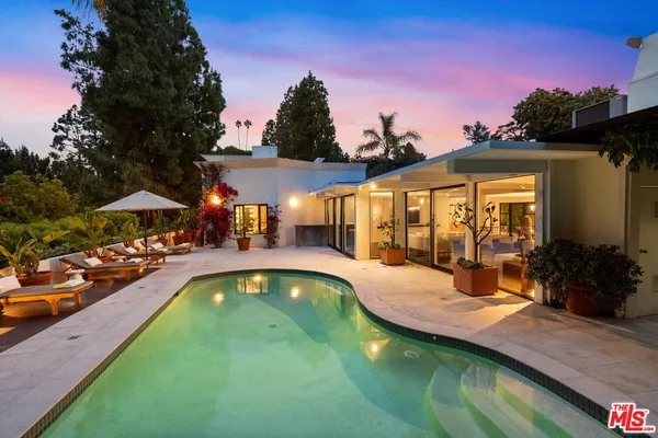 a view of swimming pool with outdoor seating