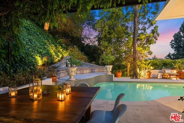 a view of a swimming pool with a patio
