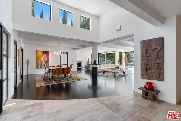 a view of a living room and dining room