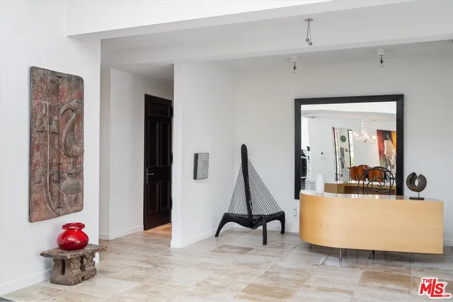 a view of living room with furniture and wooden floor