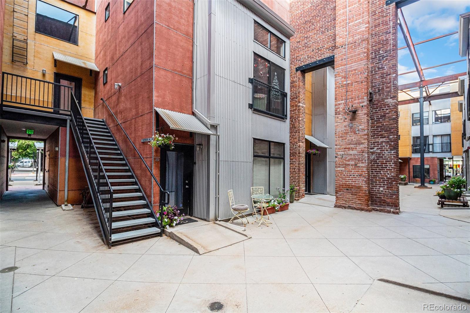 3225 Blake Street, Unit 24 Denver, CO 80205 - Photo 22 of 25 a view of a building with barbeque grill and building