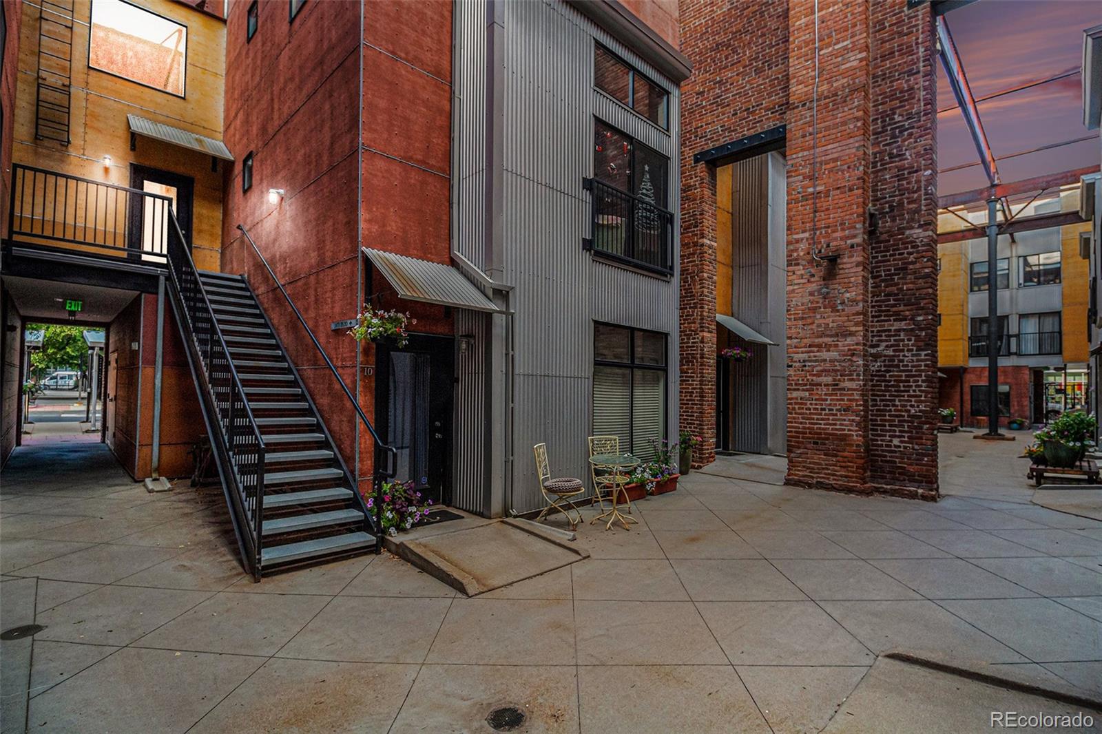 3225 Blake Street, Unit 24 Denver, CO 80205 - Photo 24 of 25 a view of a building with barbeque oven and stairs