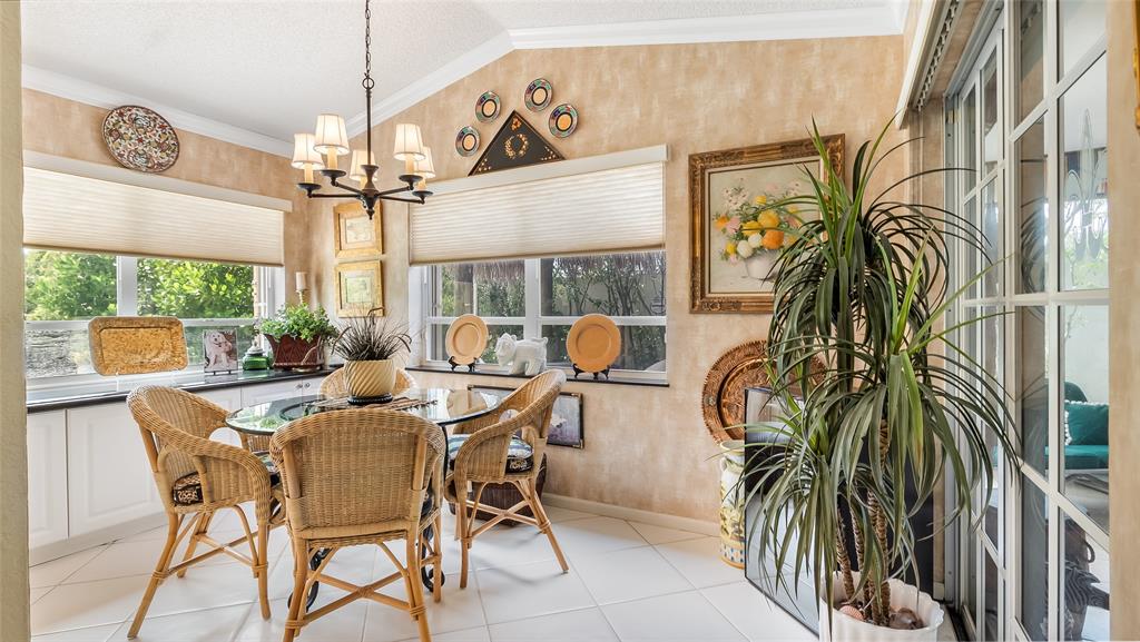 7844 Travelers Tree Drive Boca Raton, FL 33433 - Photo 14 of 40 a view of a dining room with furniture window and outside view