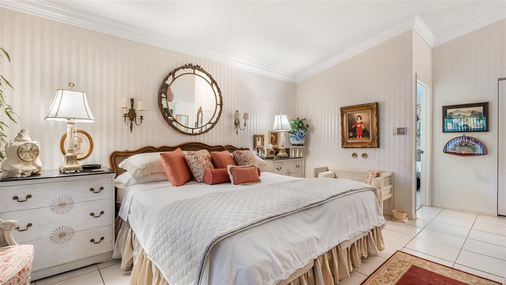 7844 Travelers Tree Drive Boca Raton, FL 33433 - Photo 16 of 40 a bedroom with a bed and a lamp on dresser next to a window