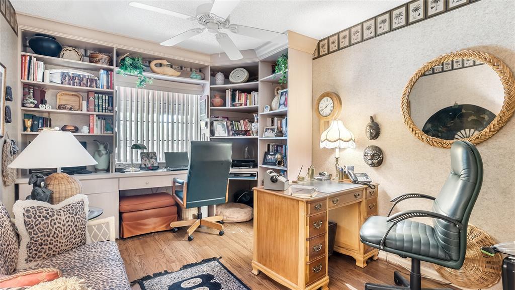 7844 Travelers Tree Drive Boca Raton, FL 33433 - Photo 23 of 40 a work room with furniture and a book shelf