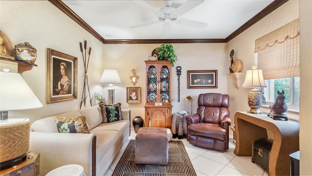 7844 Travelers Tree Drive Boca Raton, FL 33433 - Photo 25 of 40 a living room with furniture and a large window