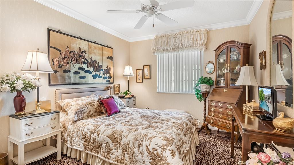 7844 Travelers Tree Drive Boca Raton, FL 33433 - Photo 26 of 40 a bedroom with bed and wooden floor