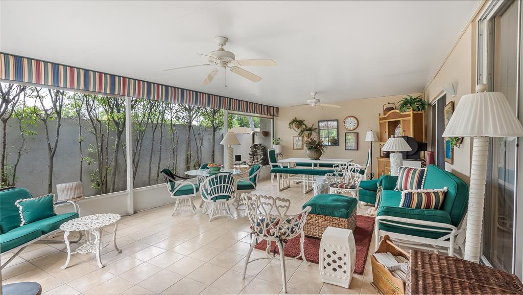 7844 Travelers Tree Drive Boca Raton, FL 33433 - Photo 28 of 40 a living room with furniture and a large window