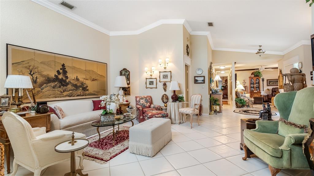 7844 Travelers Tree Drive Boca Raton, FL 33433 - Photo 3 of 40 a living room with furniture and a large window