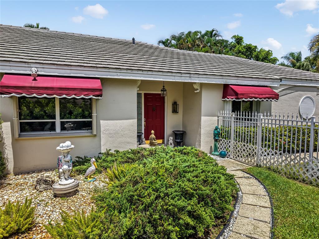 7844 Travelers Tree Drive Boca Raton, FL 33433 - Photo 31 of 40 a front view of a house with a porch