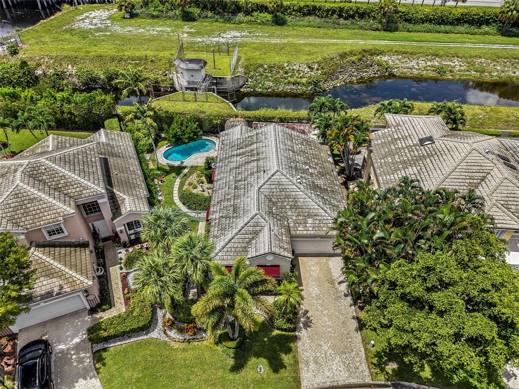7844 Travelers Tree Drive Boca Raton, FL 33433 - Photo 38 of 40 a view of a garden with lawn chairs
