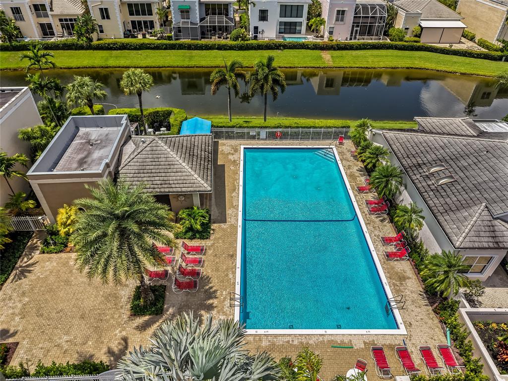 7844 Travelers Tree Drive Boca Raton, FL 33433 - Photo 40 of 40 a view of swimming pool with outdoor seating and yard