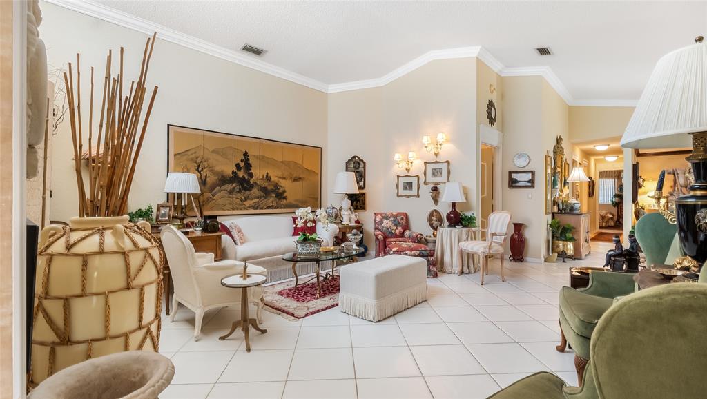 7844 Travelers Tree Drive Boca Raton, FL 33433 - Photo 6 of 40 a living room with furniture a rug and white walls