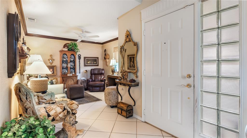 7844 Travelers Tree Drive Boca Raton, FL 33433 - Photo 9 of 40 a view of a livingroom with furniture and a window