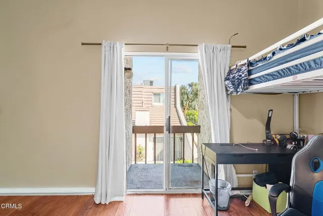 a view of a livingroom with furniture and a window