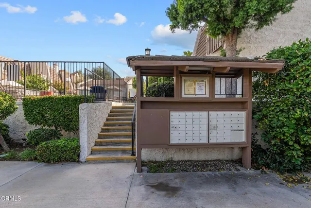 a view of balcony with wooden floor and stairs