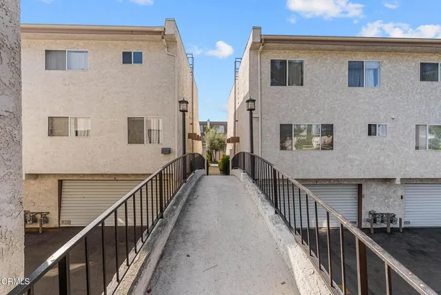 a view of a house with a yard and garden