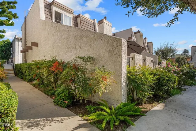 a view of a backyard with a patio