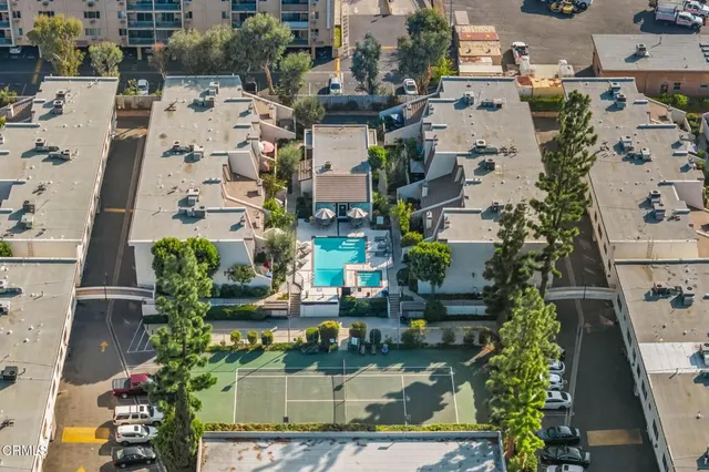 a view of a swimming pool with chairs