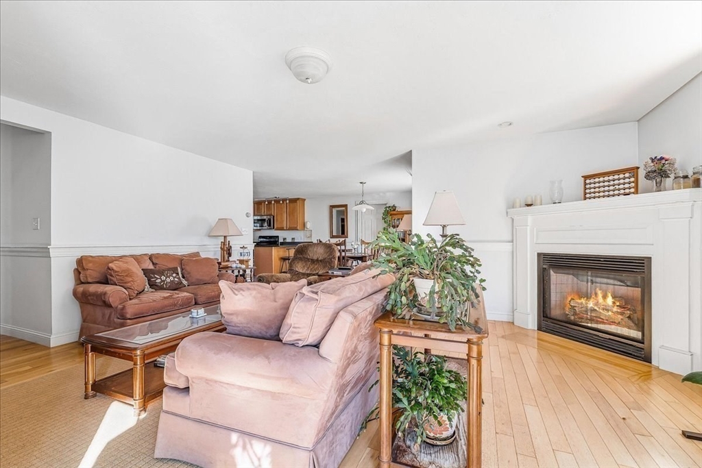 4 Old Field Road, Unit 4 Plymouth, MA 02360 - Photo 20 of 42 a living room with furniture and a fireplace