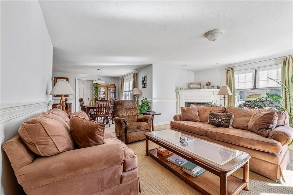 4 Old Field Road, Unit 4 Plymouth, MA 02360 - Photo 21 of 42 a living room with furniture a large window and a rug
