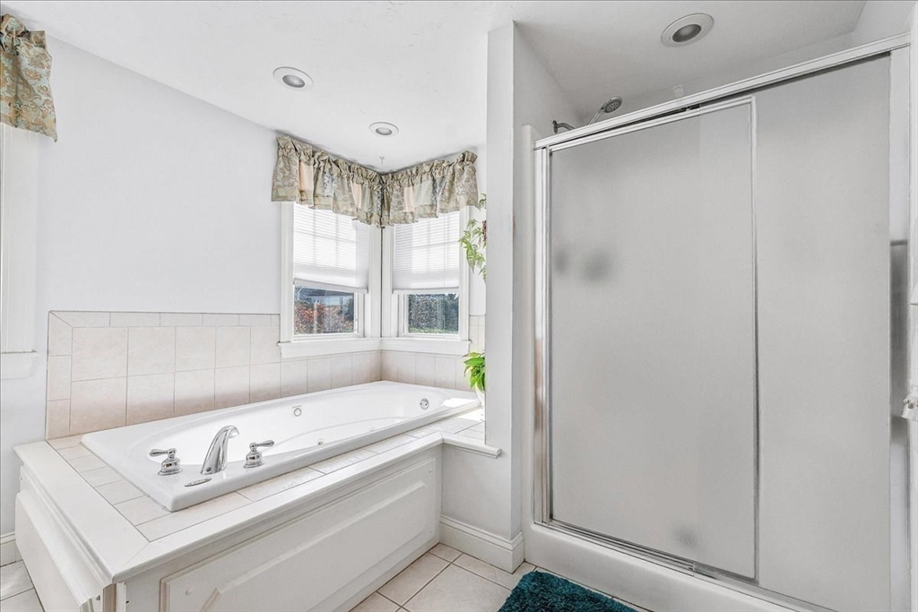 4 Old Field Road, Unit 4 Plymouth, MA 02360 - Photo 30 of 42 a bathroom with a tub sink and shower