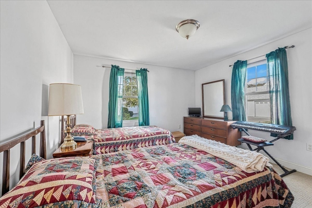 4 Old Field Road, Unit 4 Plymouth, MA 02360 - Photo 31 of 42 a bedroom with bed and a window