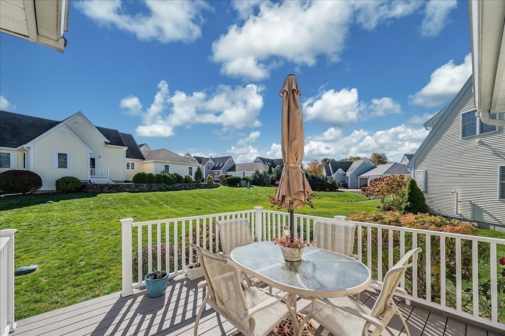 4 Old Field Road, Unit 4 Plymouth, MA 02360 - Photo 6 of 42 a view of a chair and table on the roof deck
