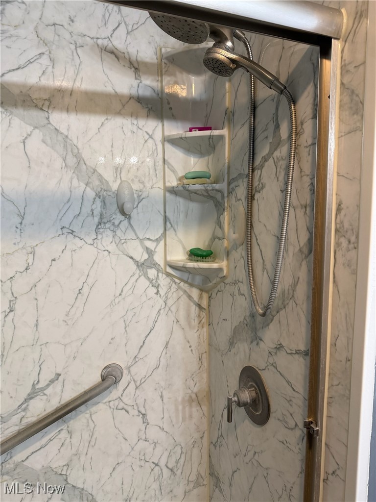 1311 Warner Road Southeast Canton, OH 44707 - Photo 9 of 14 Bathroom view of a marble finish shower