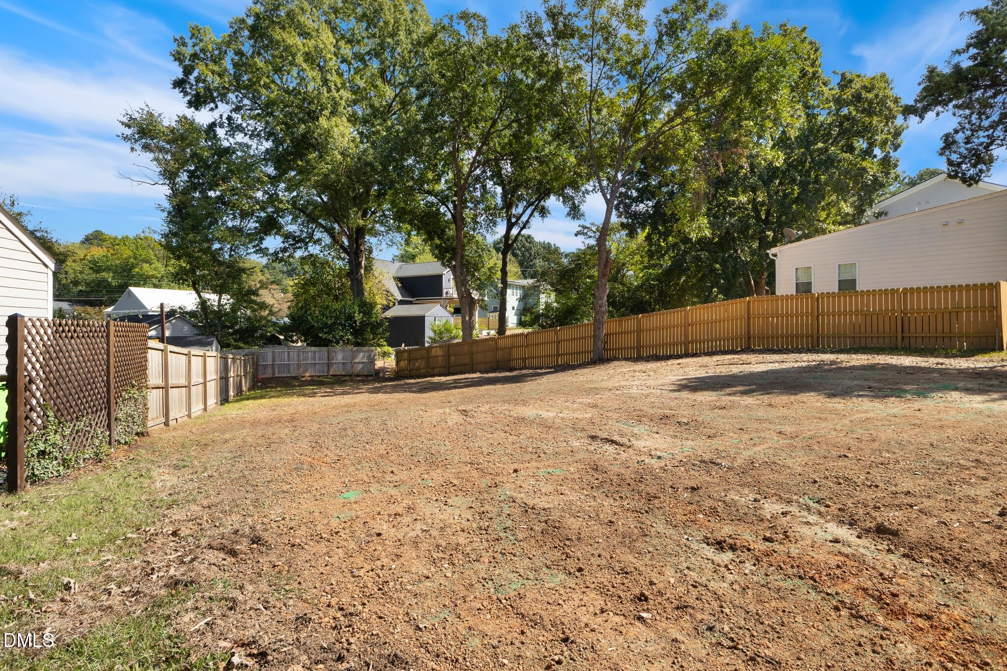 109 Plainview Avenue Raleigh, NC 27604 - Photo 4 of 17 a backyard of a house with large trees and outdoor seating