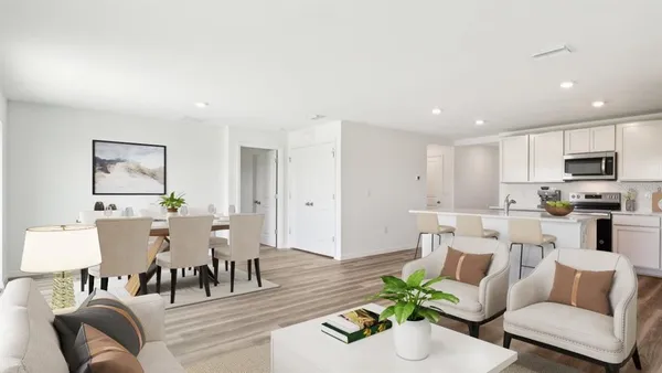 a living room with furniture and a dining table with wooden floor