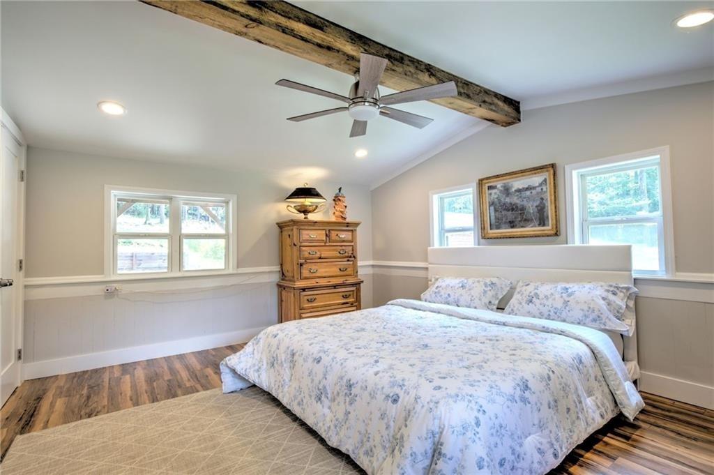 18131 Morganton Highway Morganton, GA 30560 - Photo 19 of 71 a bedroom with a large bed and a window