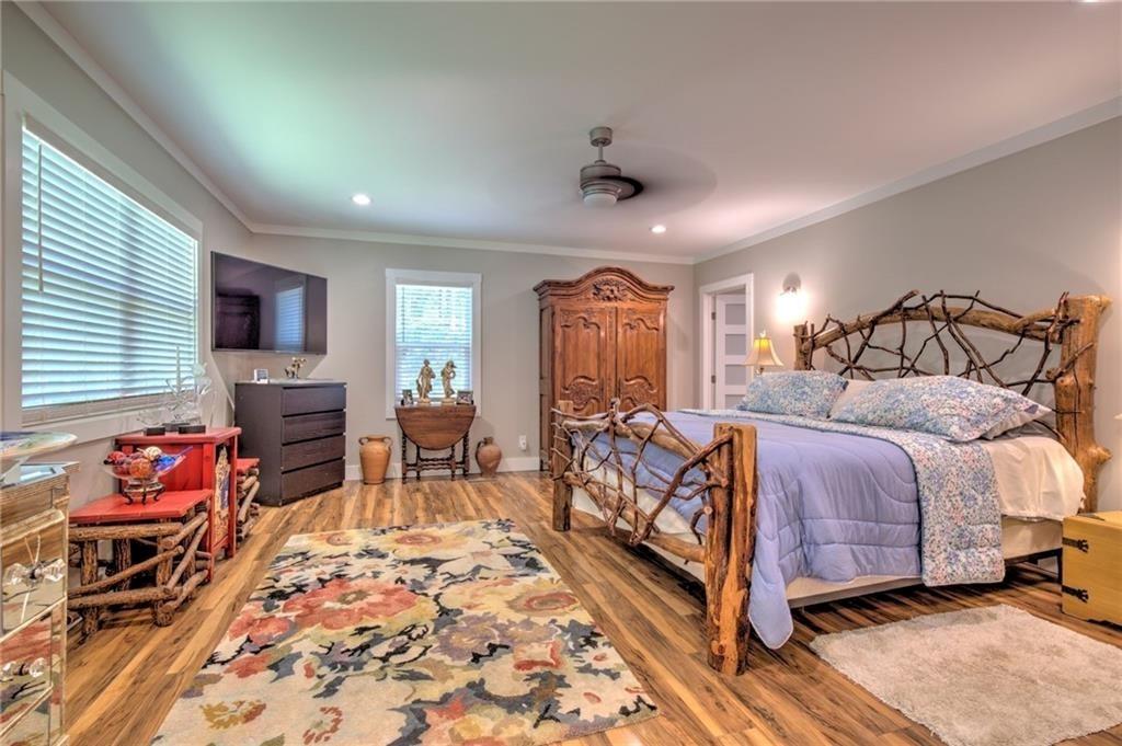 18131 Morganton Highway Morganton, GA 30560 - Photo 21 of 71 a bedroom with a bed and wooden floor